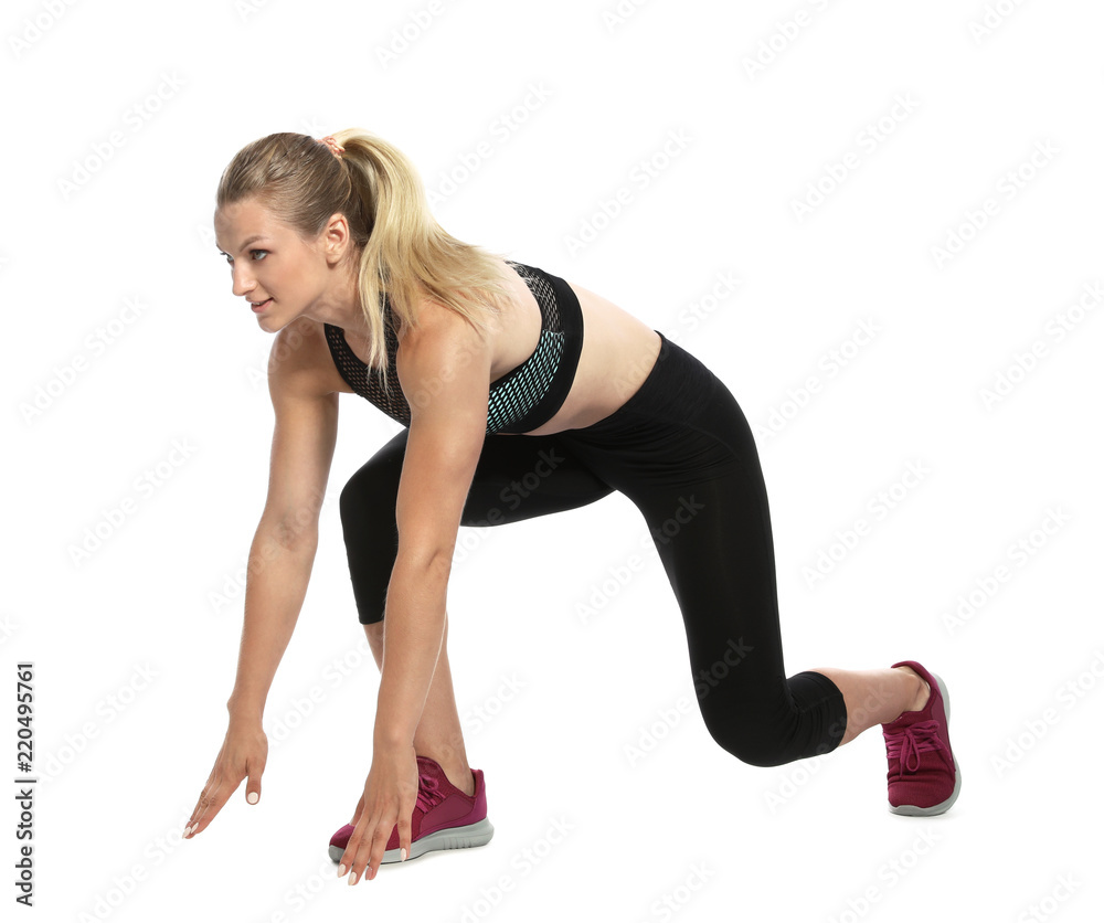 Young woman ready to run on white background Young woman ready to run on white background
