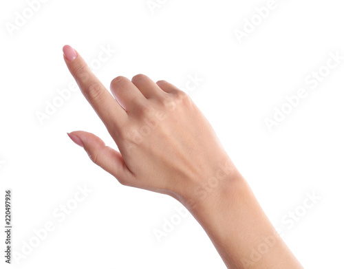 Woman pointing to something on white background, closeup photo