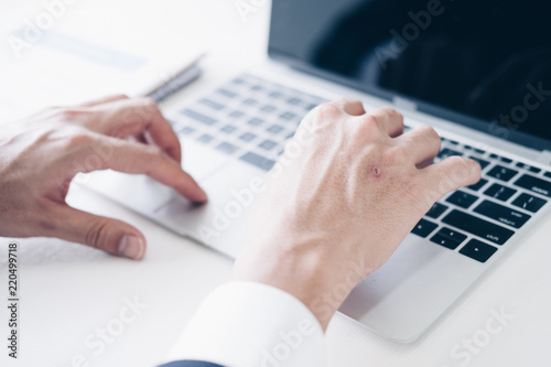 Businessman using laptop computer for budget planner in modern office, white background, Business and Office concept.