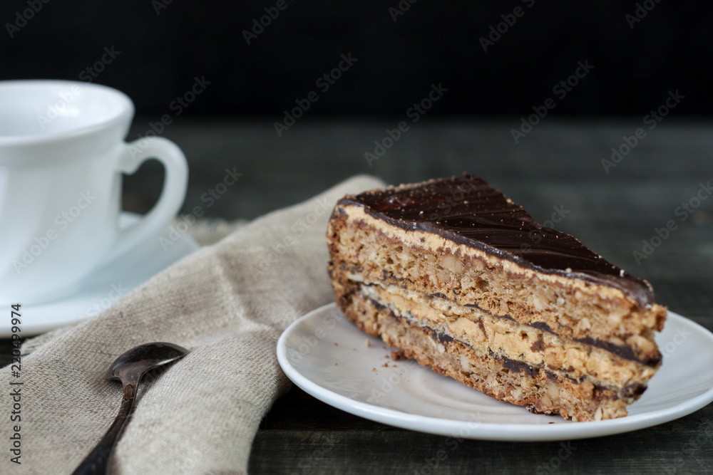 Tasty piece of chocolate cake on wooden table background Tasty piece of chocolate cake on wooden table background