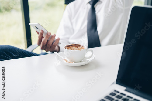 Empty coffee cup after drink by businessman in modern office, Business and Office concept.