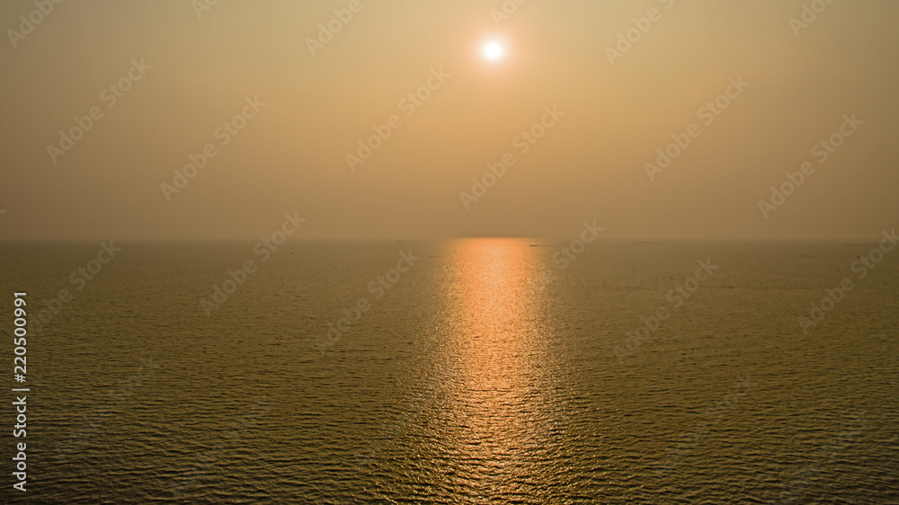 Wonderful dark silver sea with sunset twilight sky in the evening time. scenery moment. spirit of serene and zen. image for background, wallpaper, interior, decorate and copy space.