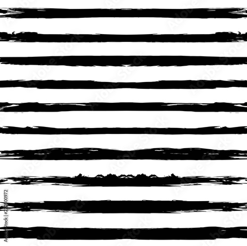 Seamless pattern from long black textured smears on a white background