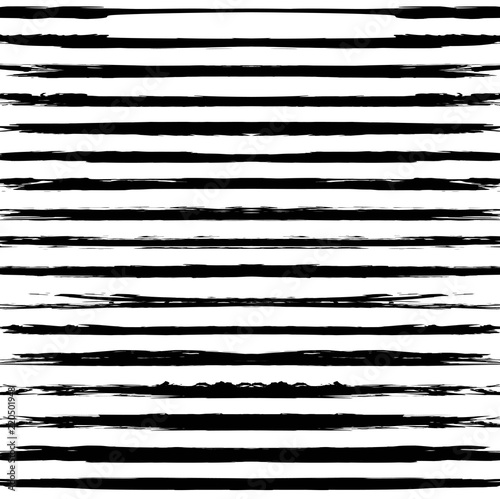 Seamless pattern from black long textured smears on a white background