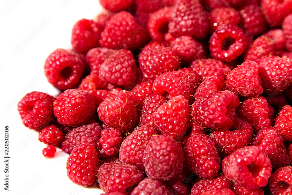 Heap of fresh red ripe raspberries on white background Heap of fresh red ripe raspberries on white background
