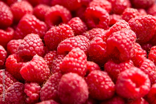Fresh red ripe raspberries background