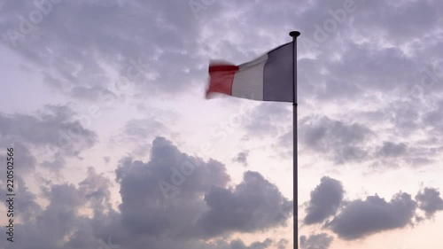 French flag in the sunset clouds