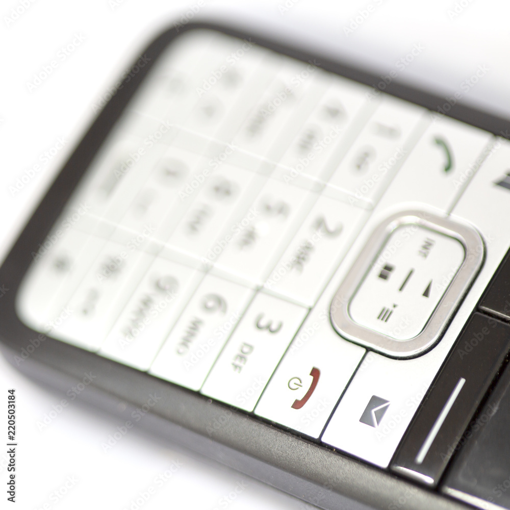 blurred cordless with symbol of e-mail and the keyboard blurred cordless with symbol of e-mail and the keyboard