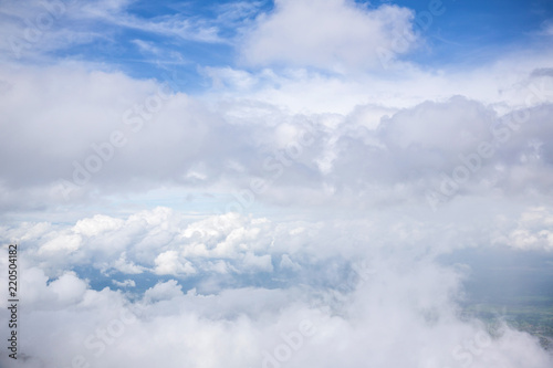 cloudy and blue sky for background. nature background white cloud and blue sky view from airplane windows. Beautiful view of clouds and sky from a plane window.