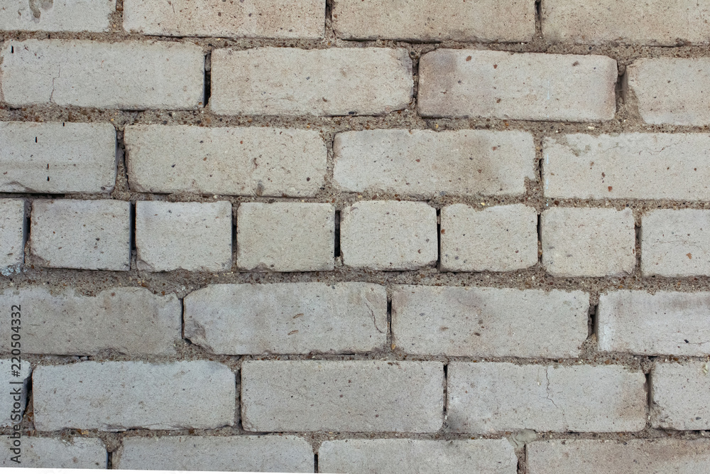 Abstract background of a fragment of the blank clean wall from rectangular white silicate brick. Texture seven complete series of brick masonry. Abstract background of a fragment of the blank clean wall from rectangular white silicate brick. Texture seven complete series of brick masonry.