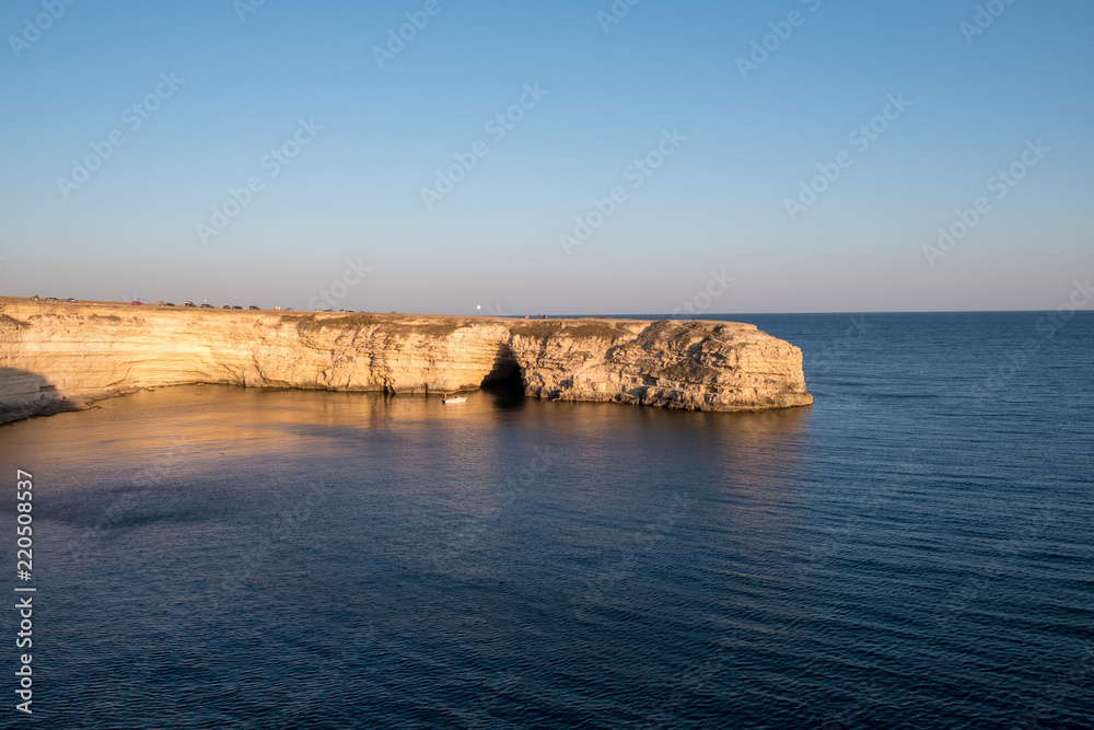 The Crimean Peninsula-Cape Tarkhankut summer is pure Black sea, rocky shore, evening light