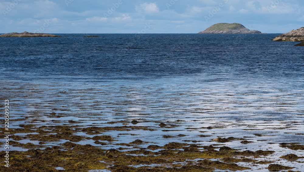 Panoramic view of the Scottish Highlands looking out to sea near Lochinver, north west coast of Scotland. Panoramic view of the Scottish Highlands looking out to sea near Lochinver, north west coast of Scotland.