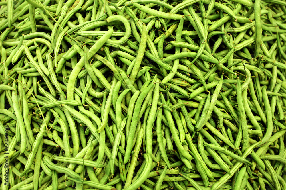 Heap of wet green (string) beans displayed on food market. Heap of wet green (string) beans displayed on food market.