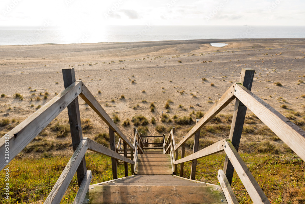 wooden steps heading down over the beach and sand dunes at Lowestoft Suffolk wooden steps heading down over the beach and sand dunes at Lowestoft Suffolk