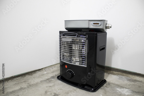 Black kerosene heater in a white background