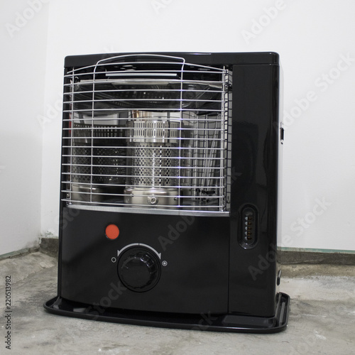 Black kerosene heater in a white background photo