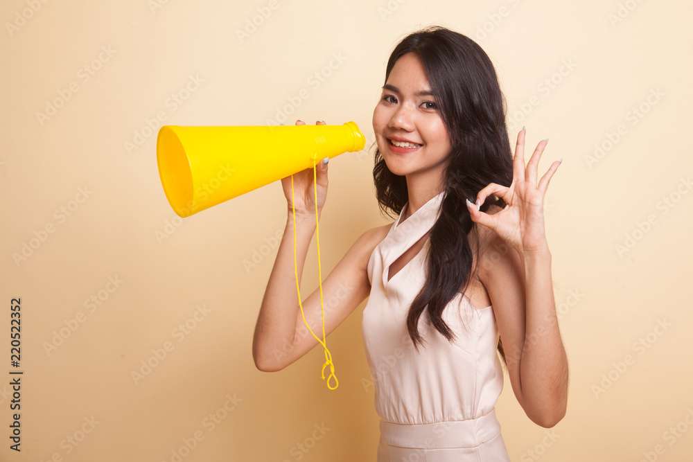 Beautiful young Asian woman show OK announce with megaphone. Beautiful young Asian woman show OK announce with megaphone.