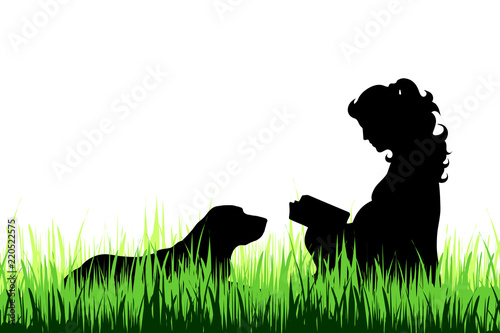 Vector silhouette of pregnat woman with dog on the meadow. photo