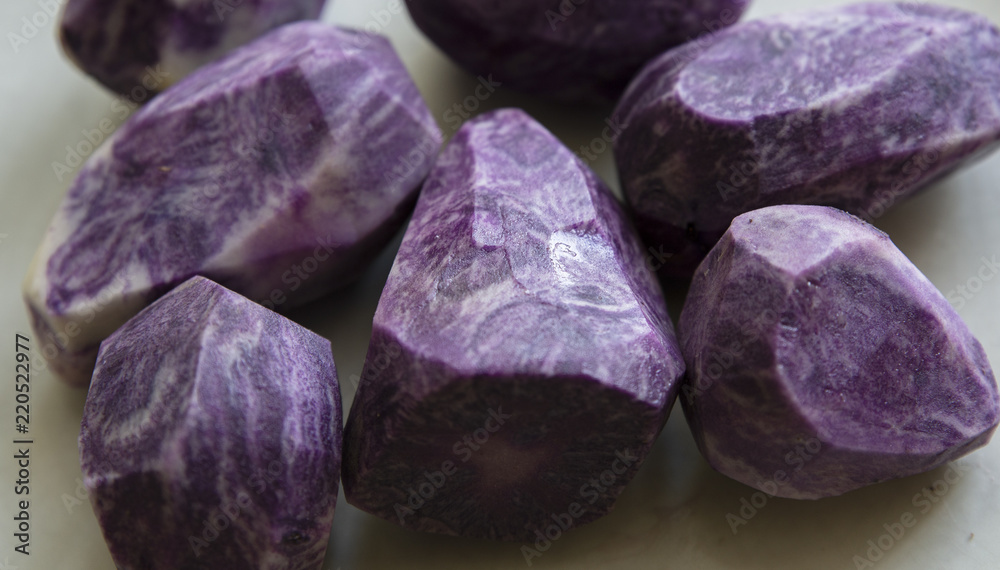 close up on Vitelotte blue-violet potato close up on Vitelotte blue-violet potato