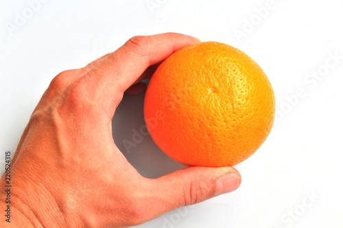 The orange in his hand