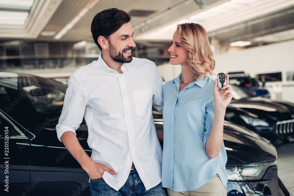 couple holding keys of new car couple holding keys of new car