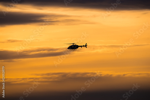 silhouette of helicopter at sunset © Media_Works
