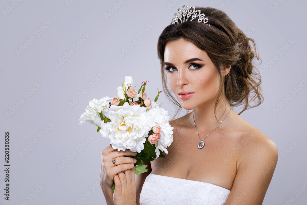 Portrait of young beautiful bride with bouquet of flowers Portrait of young beautiful bride with bouquet of flowers