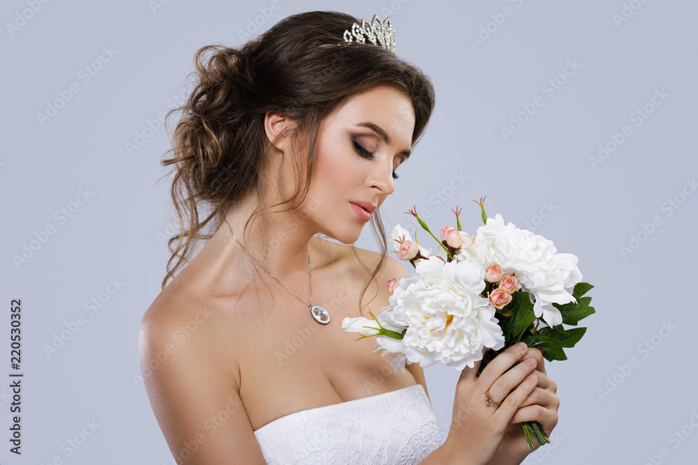 Portrait of young beautiful bride with bouquet of flowers Portrait of young beautiful bride with bouquet of flowers
