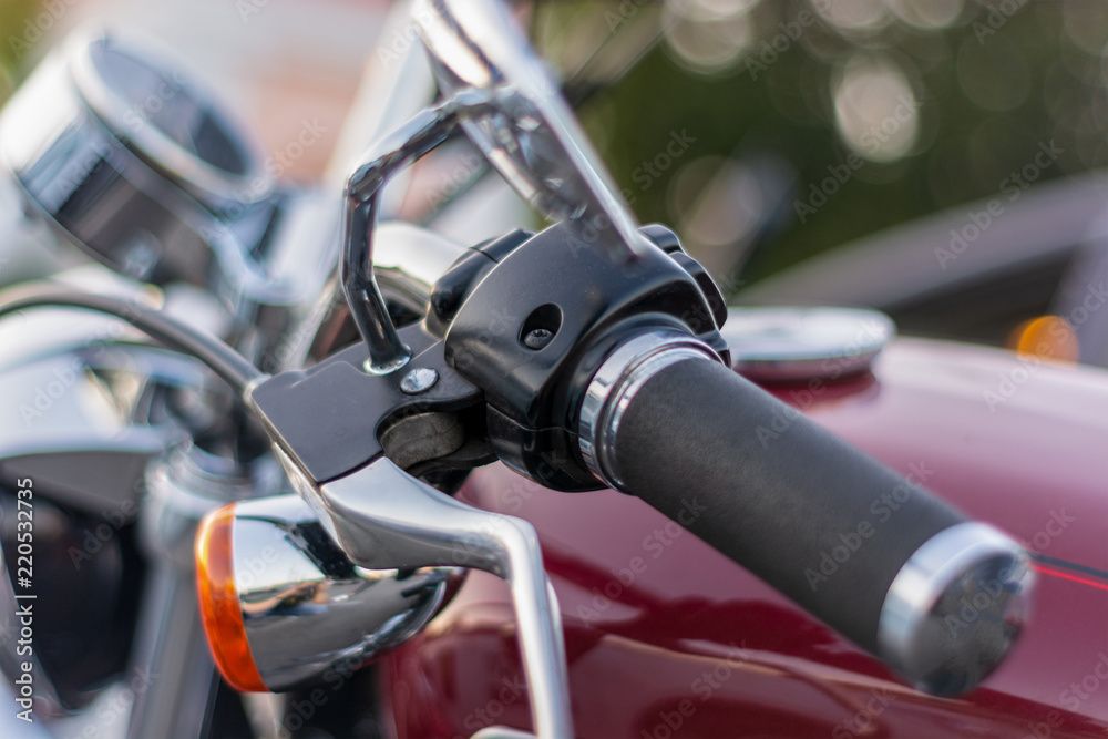 close-up of the handle on the handlebars of a motorcycle close-up of the handle on the handlebars of a motorcycle
