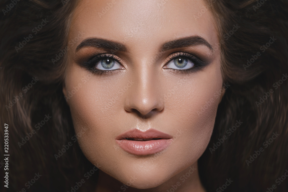 Gorgeous woman with a beautiful hairstyle and make-up Gorgeous woman with a beautiful hairstyle and make-up