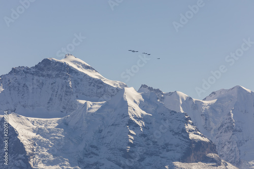 The Swiss Air Force flies a display over the Alps in the Bernese Oberland