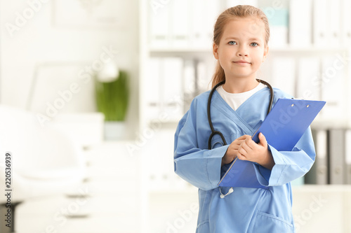 Cute little girl in doctor ...
