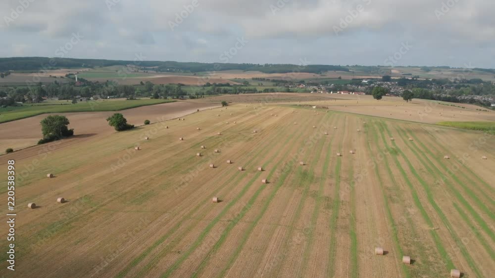 Pretty round hay bales in the French countryside, aerial. Pretty round hay bales in the French countryside, aerial.