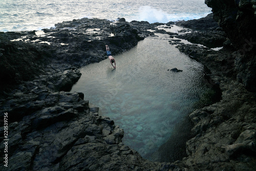 man jumps into tide pool