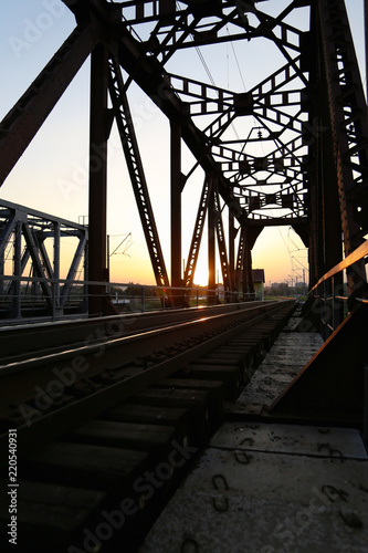 Sunset on the railway bridge. Evening