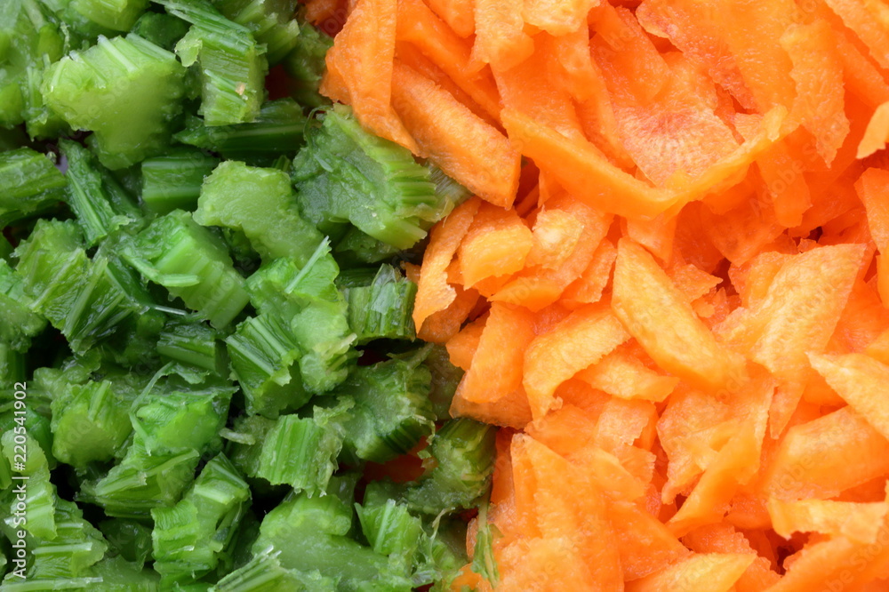 Minced green celery and orange carrot side by side Minced green celery and orange carrot side by side
