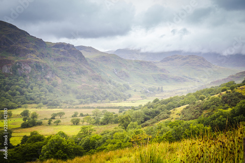 Landscape of Snowdonia National Park on a rainy and foggy day in Wales, UK © HildaWeges