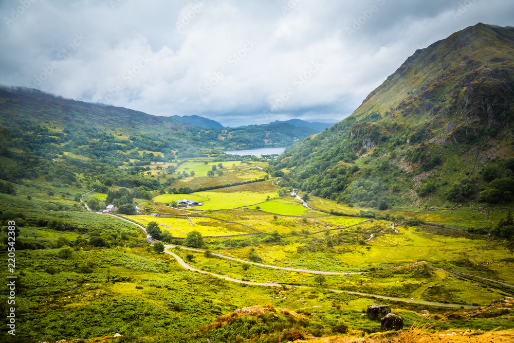 Landscape of Snowdonia National Park with a view on Gwynant lake on a rainy and foggy day in Wales, UK Landscape of Snowdonia National Park with a view on Gwynant lake on a rainy and foggy day in Wales, UK
