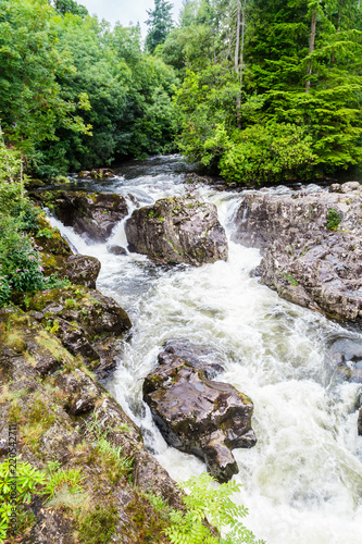 Traditional bridge and rapids of  Betws-y-Coed town in Snowdonia National Park in  Wales, UK