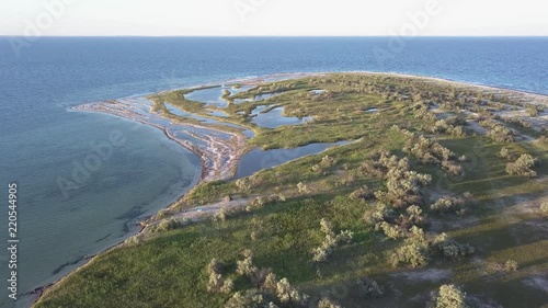 National park Dzharylhac of Ukraine. The biggest island of Black sea. Drone shot of beautiful lakes, white sand beach and sea. photo