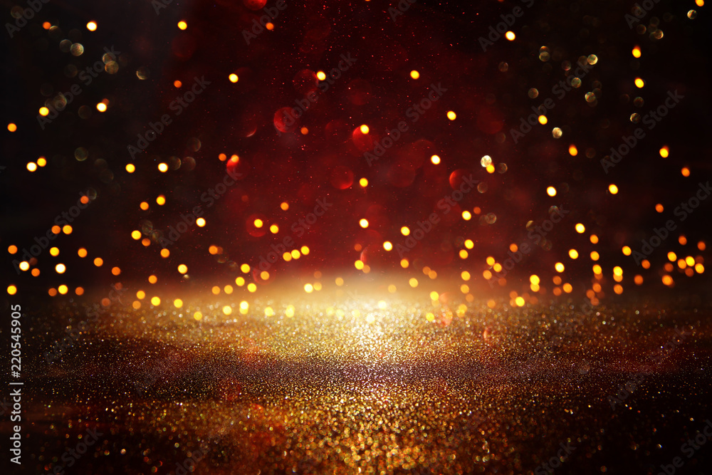 Fototapeta premium Red, black and gold glitter vintage lights background. defocused.