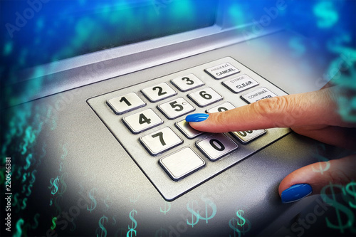 Φωτογραφία Close-up of woman’s hand introducing pin code at ATM machine for cash withdrawal