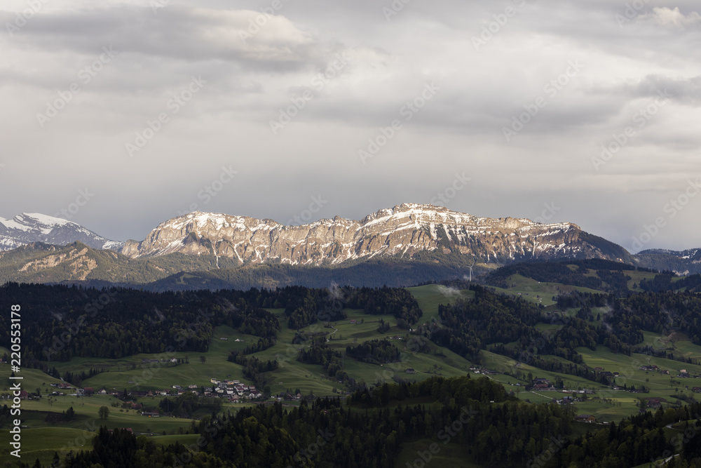 Mountain range of Pilatus with snow remains in the evening sun in the canton of Lucerne, Switzerland
