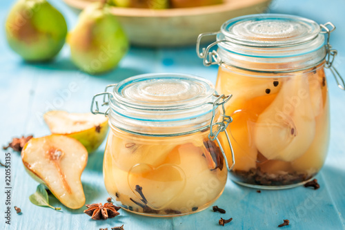Natural and juicy pickled pears in the jar