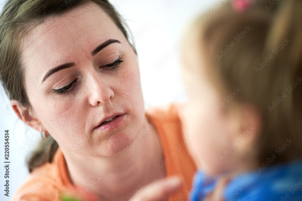 mother is taking care of daugher girl child mother is taking care of daugher girl child