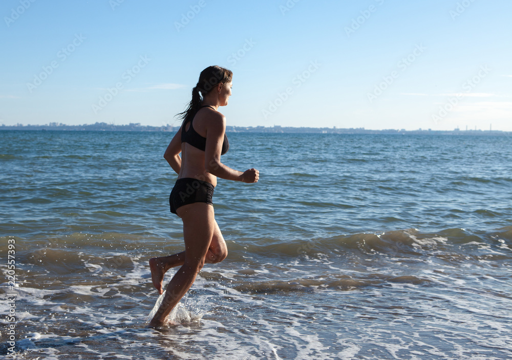 athlete running along the seashore