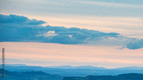 Beautiful dramatic Summer sunset landscape over English countryside with stunning light