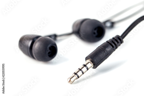 Black headphones on a white background, close up