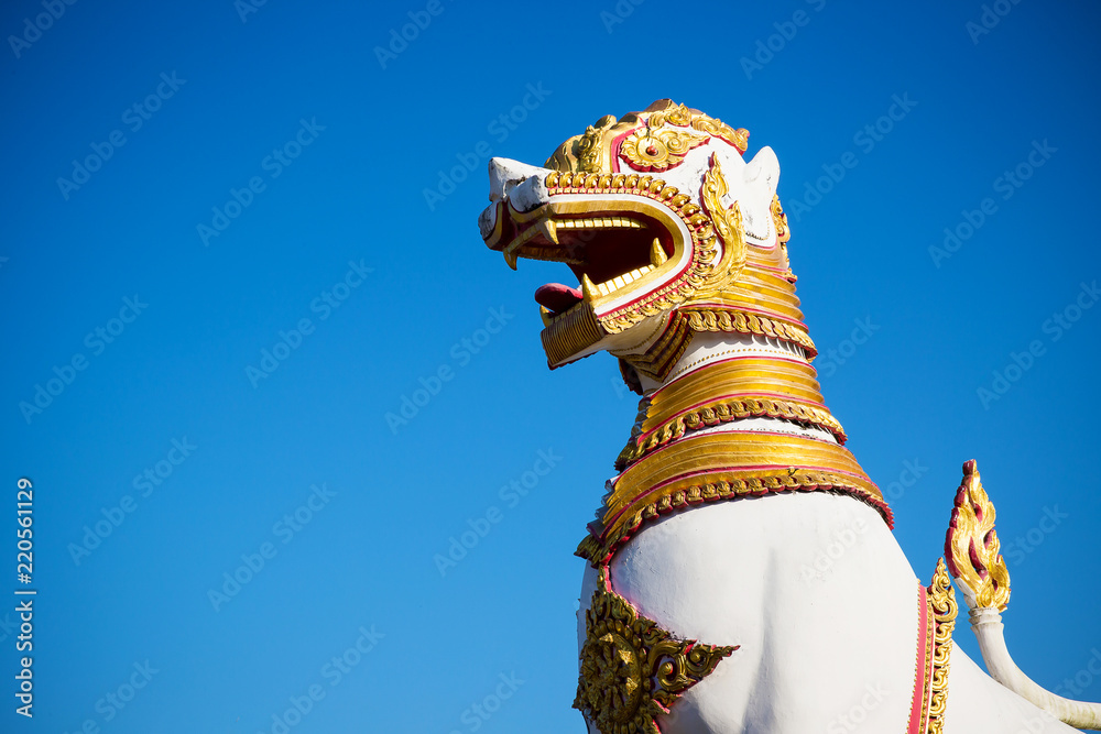 Naklejka premium Lion sculpture in Asia temple. Asia culture art. Endemic culture art of Asia. image for objects and copy space.
