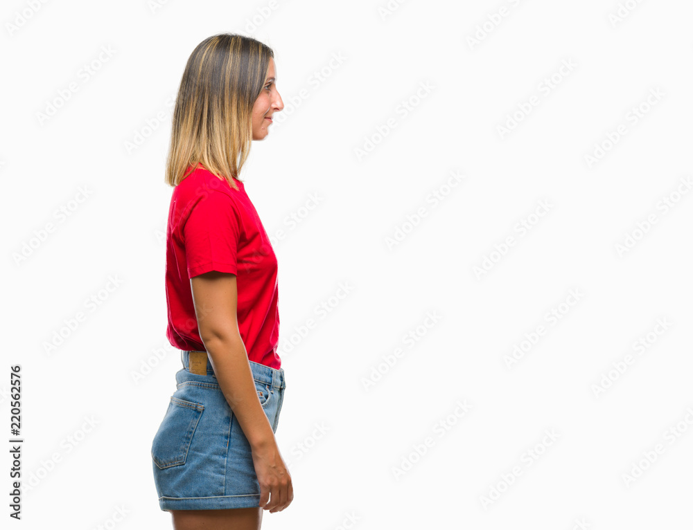 Young beautiful woman over isolated background looking to side, relax profile pose with natural face with confident smile. Young beautiful woman over isolated background looking to side, relax profile pose with natural face with confident smile.